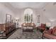 Cozy living room featuring dark hardwood floors and shuttered window at 3733 E Kachina Dr, Phoenix, AZ 85044