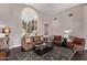 Relaxing living room with comfortable seating and shuttered window at 3733 E Kachina Dr, Phoenix, AZ 85044