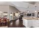 Bright and airy living space connecting kitchen, dining area, and living room, creating a seamless flow at 3733 E Kachina Dr, Phoenix, AZ 85044