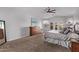 Spacious main bedroom features a ceiling fan, and an ensuite bath at 3733 E Kachina Dr, Phoenix, AZ 85044