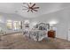 Spacious main bedroom features a ceiling fan, and an ensuite bath at 3733 E Kachina Dr, Phoenix, AZ 85044