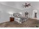 Spacious main bedroom features a ceiling fan, and an ensuite bath at 3733 E Kachina Dr, Phoenix, AZ 85044