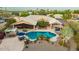 Aerial view of a sparkling pool, covered patio, manicured desert landscape, and charming pergola at 3733 E Kachina Dr, Phoenix, AZ 85044
