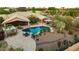View of sparkling swimming pool, covered patio and manicured desert landscape, inviting outdoor living at 3733 E Kachina Dr, Phoenix, AZ 85044