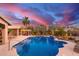 Backyard pool with beautiful tropical landscaping and a covered pergola, perfect for relaxing at 3733 E Kachina Dr, Phoenix, AZ 85044