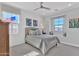 Bright bedroom featuring a comfortable bed, multiple windows, and tasteful decor at 3750 E Rochelle Cir, Mesa, AZ 85215