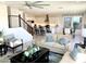 Open-concept living space with hardwood floors and abundant natural light and stairway at 3750 E Rochelle Cir, Mesa, AZ 85215