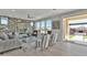 Comfortable living room with a brick wall, stylish furniture, and backyard access at 3750 E Rochelle Cir, Mesa, AZ 85215