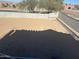 Spacious vacant lot partially fenced, ready for construction of your dream home at 3750 E Rochelle Cir, Mesa, AZ 85215