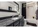 Modern bathroom featuring a sleek vanity, a stylish mirror, and a well-maintained shower-tub at 38662 N La Grange Ln, San Tan Valley, AZ 85140