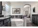 Well-lit bathroom showcases a soaking tub and granite countertops at 38662 N La Grange Ln, San Tan Valley, AZ 85140