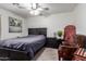 Cozy bedroom with neutral walls, ceiling fan, and rustic decorations at 38662 N La Grange Ln, San Tan Valley, AZ 85140