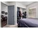 Cozy bedroom featuring an open closet with organized storage solutions and comfortable furnishings at 38662 N La Grange Ln, San Tan Valley, AZ 85140