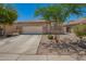 Charming single-story home with a two-car garage and desert landscaping at 38662 N La Grange Ln, San Tan Valley, AZ 85140