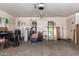 A well-lit garage with ample storage space and functional features, including a utility sink and water heater at 38662 N La Grange Ln, San Tan Valley, AZ 85140