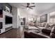 Bright and spacious living room featuring wood floors and ample seating at 38662 N La Grange Ln, San Tan Valley, AZ 85140