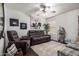 Comfortable living room with a cozy seating arrangement, a ceiling fan, and decorative accents at 38662 N La Grange Ln, San Tan Valley, AZ 85140