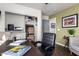 Functional home office featuring a large desk, ample storage, and comfortable seating arrangements at 38662 N La Grange Ln, San Tan Valley, AZ 85140