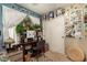 A bright bedroom space, including a built-in desk, white closet, and plant decor at 43036 W Anne Ln, Maricopa, AZ 85138