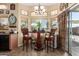 Charming breakfast nook features a round table with seating for two, and a chandelier at 43036 W Anne Ln, Maricopa, AZ 85138