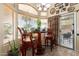 Bright breakfast nook featuring bar stool seating, natural light, and a view of the patio at 43036 W Anne Ln, Maricopa, AZ 85138