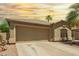Charming home exterior with a well-maintained lawn and desert landscaping at 43036 W Anne Ln, Maricopa, AZ 85138