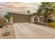 Charming home exterior with a well-maintained lawn and desert landscaping at 43036 W Anne Ln, Maricopa, AZ 85138
