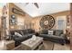 Spacious living room with comfortable sofas, area rug, ceiling fan and tasteful decor at 43036 W Anne Ln, Maricopa, AZ 85138