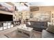 Comfortable living room showcasing stylish decor, neutral tones, and ample natural light at 43036 W Anne Ln, Maricopa, AZ 85138