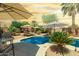 Inviting backyard pool area, perfect for relaxing with lounge chairs and desert landscaping at 43036 W Anne Ln, Maricopa, AZ 85138