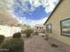 View of the low maintenance backyard area with mature landscaping, block wall and gravel groundcover at 4440 S Leisure Way, Gilbert, AZ 85297