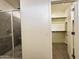 Walk-in closet adjacent to a luxurious bathroom with a tiled shower at 4440 S Leisure Way, Gilbert, AZ 85297