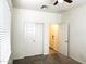 Comfortable bedroom featuring a closet with sliding doors and neutral carpeting at 4440 S Leisure Way, Gilbert, AZ 85297