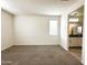 Bedroom featuring neutral carpet, and large windows. Access to bathroom at 4440 S Leisure Way, Gilbert, AZ 85297