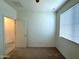Bright bedroom features carpet, window, and light-colored walls at 4440 S Leisure Way, Gilbert, AZ 85297