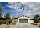 Charming single-story home with a two-car garage, low-maintenance landscaping and neutral-tone stucco exterior at 4440 S Leisure Way, Gilbert, AZ 85297