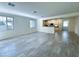 Spacious living room featuring tile flooring and an open floorplan to the kitchen at 4440 S Leisure Way, Gilbert, AZ 85297