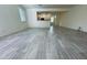 Open living room with a view into the kitchen featuring modern finishes and lots of natural light from the windows at 4440 S Leisure Way, Gilbert, AZ 85297