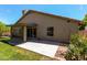 Exterior of home shows a covered patio, sliding glass door, and grassy yard at 4544 E Campo Bello Dr, Phoenix, AZ 85032