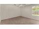 Bedroom with a ceiling fan and a view from the windows, carpeted flooring, and neutral paint at 4544 E Campo Bello Dr, Phoenix, AZ 85032