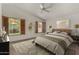 Bright bedroom featuring shuttered windows, vaulted ceilings and neutral decor for a calming and elegant aesthetic at 4544 E Campo Bello Dr, Phoenix, AZ 85032