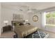 Comfortable bedroom showcasing a ceiling fan, soft lighting, and a cozy king-sized bed at 4544 E Campo Bello Dr, Phoenix, AZ 85032