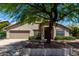 Charming single-story home featuring a well-maintained front yard and mature shade tree at 4544 E Campo Bello Dr, Phoenix, AZ 85032