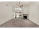 Open living room with a fireplace and a sliding door to the backyard and neutral tones at 4544 E Campo Bello Dr, Phoenix, AZ 85032