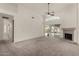 Large living room features a fireplace, a ceiling fan, and a sliding glass door at 4544 E Campo Bello Dr, Phoenix, AZ 85032