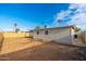 Spacious backyard with new wood fence, covered gazebo, and clear blue skies at 4922 W Coolidge St, Phoenix, AZ 85031
