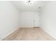 An empty bedroom featuring neutral carpet, white walls, and a modern light fixture at 4922 W Coolidge St, Phoenix, AZ 85031