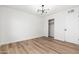 Cozy bedroom featuring wood floors, a closet, and updated lighting at 4922 W Coolidge St, Phoenix, AZ 85031