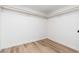 A standard closet with storage rack and wood floor at 4922 W Coolidge St, Phoenix, AZ 85031