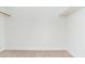 Carpeted walk-in closet with rod and shelf at 4922 W Coolidge St, Phoenix, AZ 85031